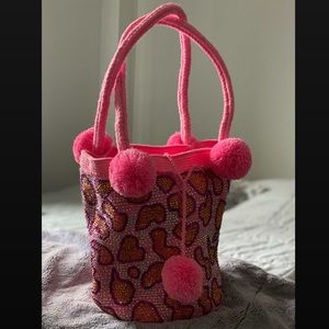 Multicolor shiny bag handmade using a unique technique and a special thread .